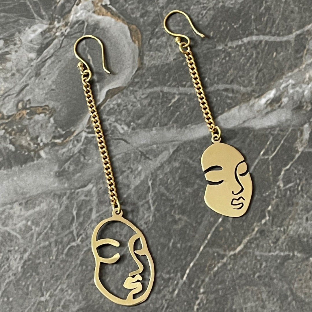 Abstract top face earrings